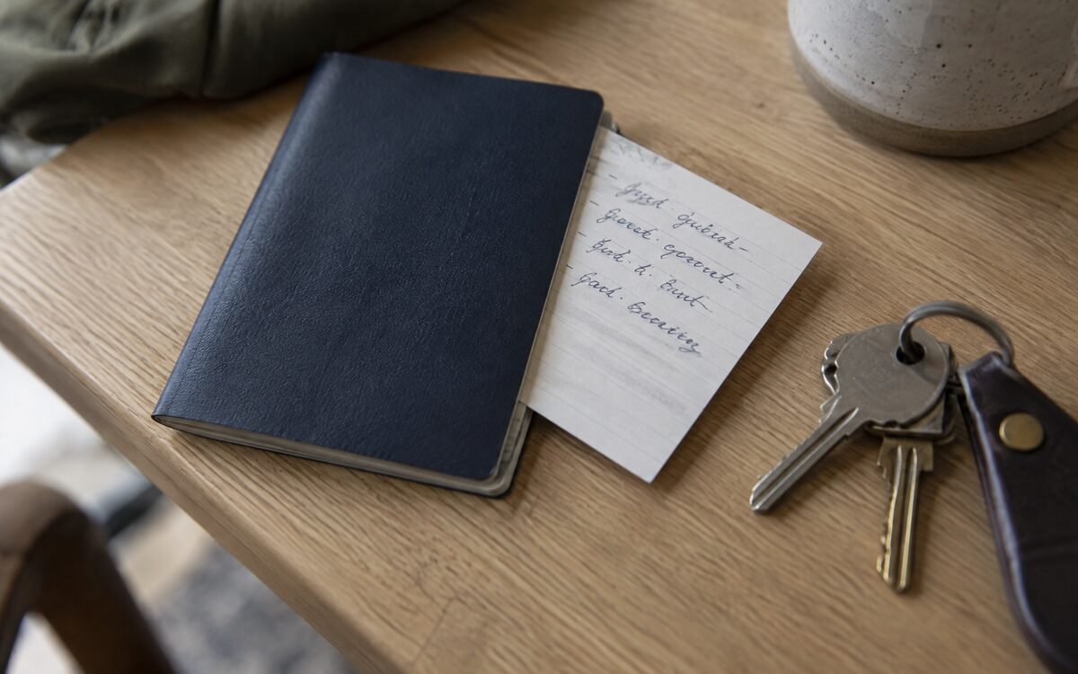 A handwritten arrival plan tucked into a passport